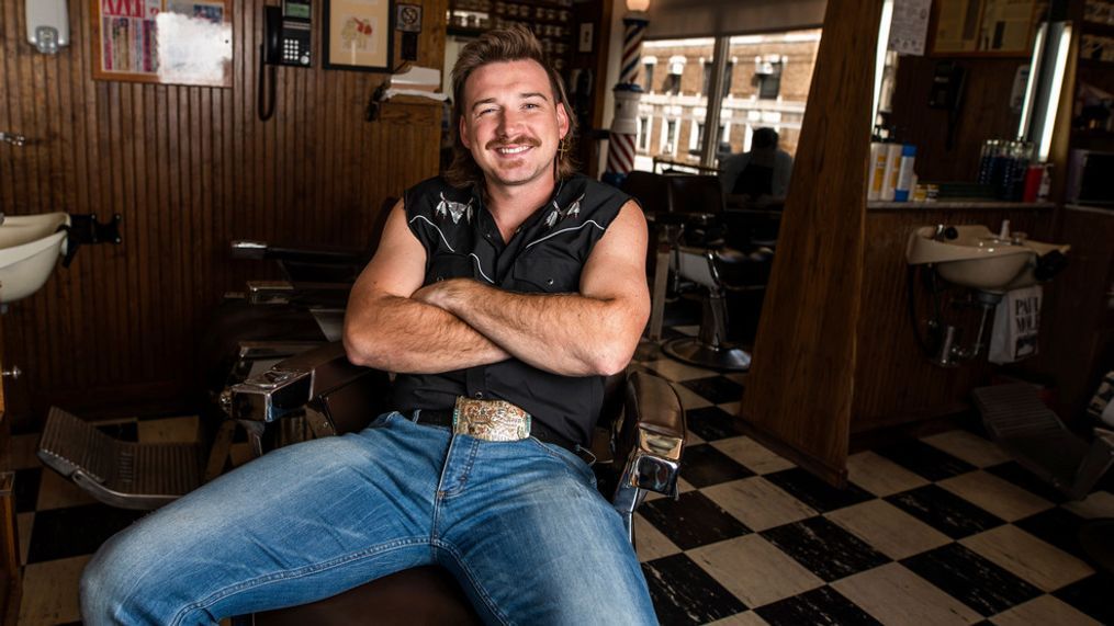 FILE - In this Aug. 27, 2019 file photo, Country singer Morgan Wallen poses for a portrait after getting a mullet at Paul Mole Barber Shop on , in New York. Wallen wasn’t allowed to compete at this month’s Academy of Country Music Awards because the singer was caught on camera using a racial slur earlier this year, but he’s one of the top nominees at the 2021 Billboard Awards. (Photo by Charles Sykes/Invision/AP, File)